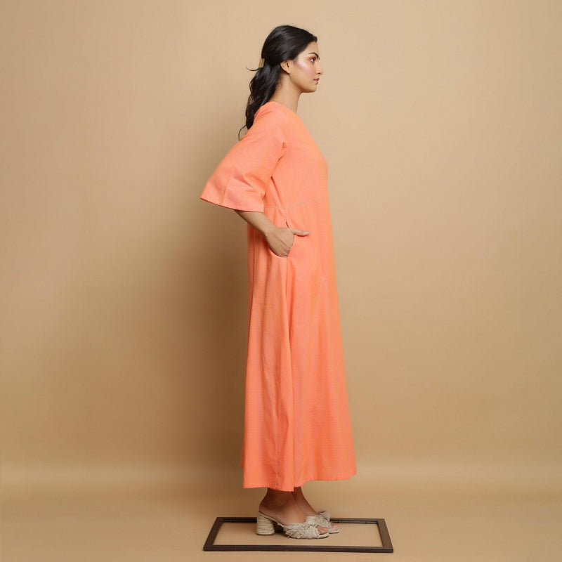 Right View of a Model wearing Salmon Pink Mangalgiri Cotton Flared Dress