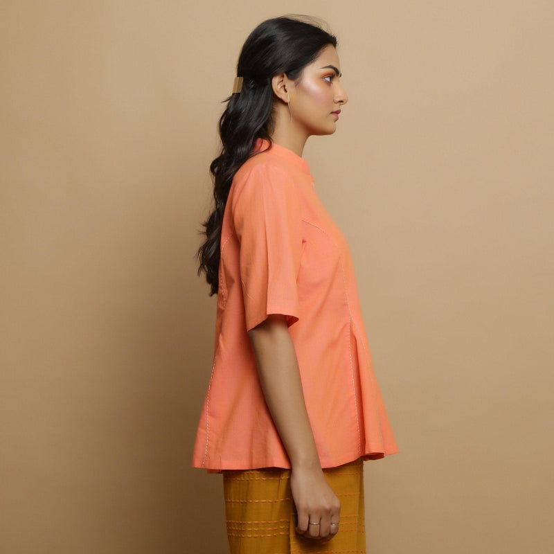 Right View of a Model wearing Handwoven Cotton Godet Button-Down Top