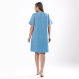 Back View of a Model wearing Handspun Sky Blue Yoked Shift Dress