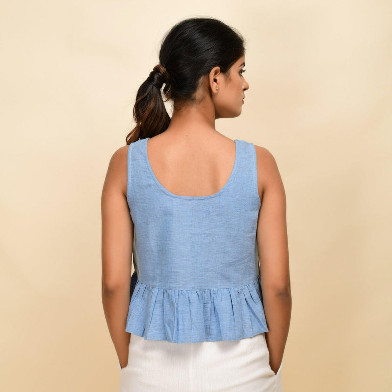 Back View of a Model wearing Sky Blue Handwoven 100% Cotton Peplum Top