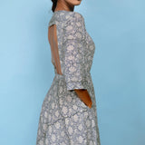 Right Detail of a Model wearing Slate Blue Block Printed Cotton Midi Dress