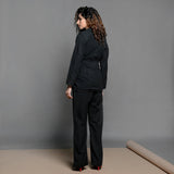 Back View of a Model wearing Black Handspun Cotton Belted Blazer