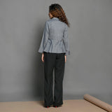 Back View of a Model wearing Slate Grey Handspun Cotton Peplum Top