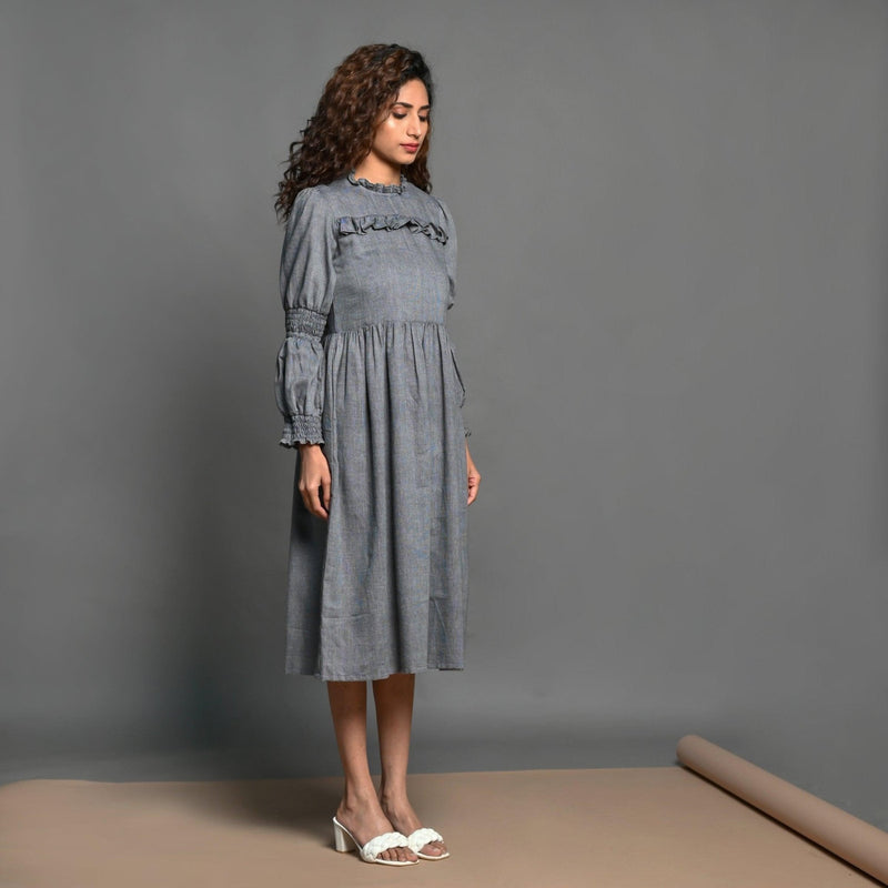 Right View of a Model wearing Grey Handspun Cotton Frilled Peasant Dress