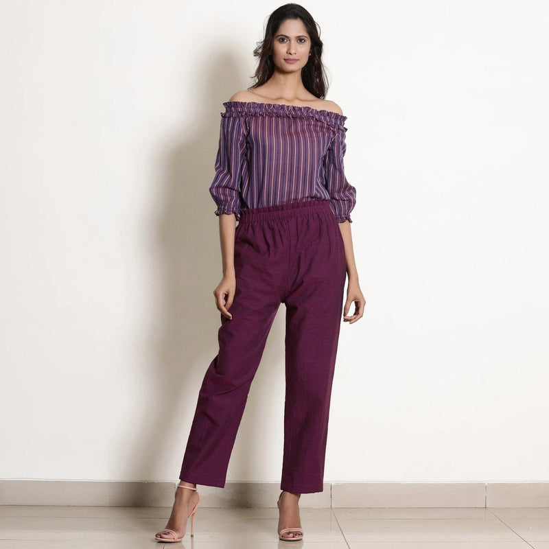 Front View of a Model wearing Solid Berry Wine Warm Cotton Tapered Pant