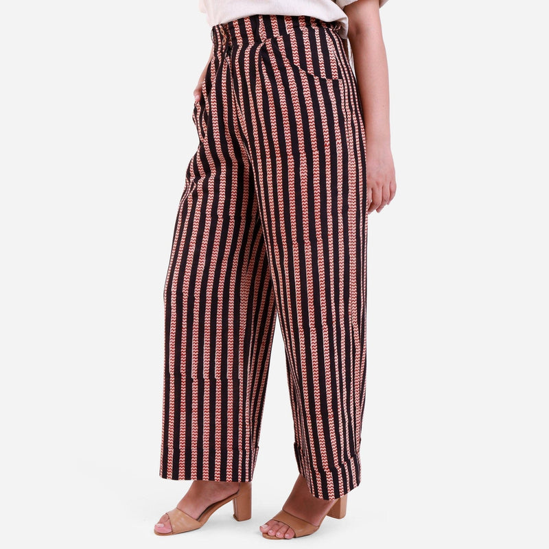 Left View of a Model wearing Striped High-Rise Baggy Cotton Pant