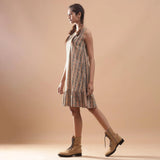 Left View of a Model wearing Striped Block Printed Cotton Knee Length Dress