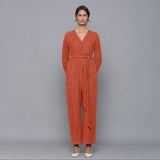 Front View of a Model wearing Sunset Rust Corduroy Comfy Jumpsuit