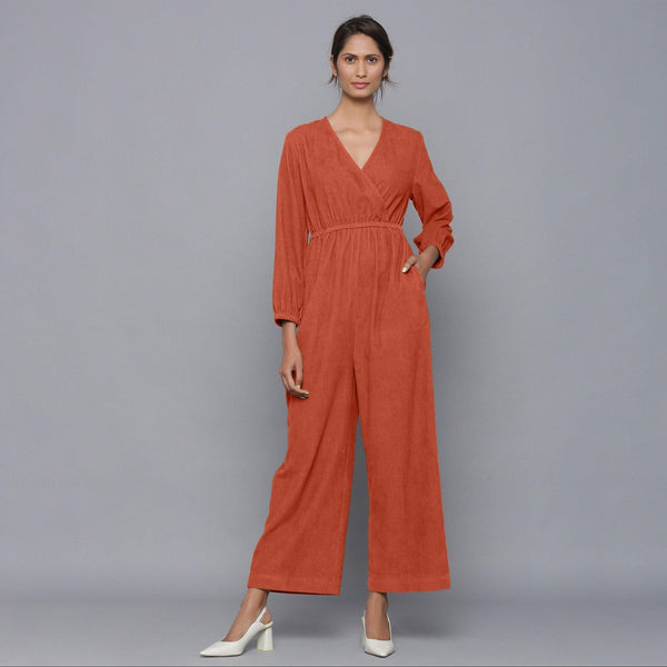 Front View of a Model wearing Sunset Rust Corduroy Comfy Jumpsuit