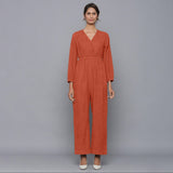 Front View of a Model wearing Sunset Rust Corduroy Comfy Jumpsuit