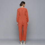 Back View of a Model wearing Sunset Rust Corduroy Comfy Jumpsuit