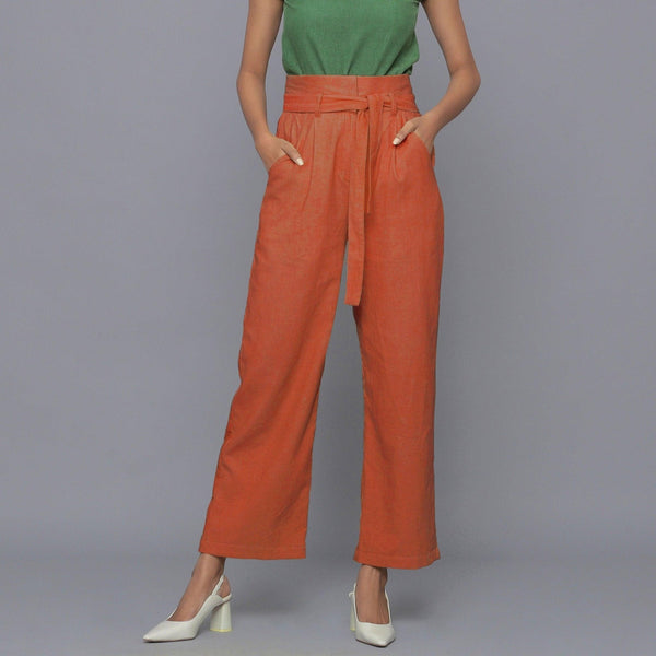 Front View of a Model wearing Sunset Rust Cotton Corduroy Pant