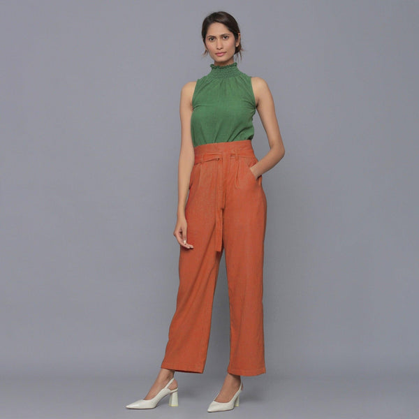 Front View of a Model wearing Sunset Rust Cotton Corduroy Pant