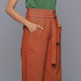 Right Detail of a Model wearing Sunset Rust Cotton Corduroy Pant