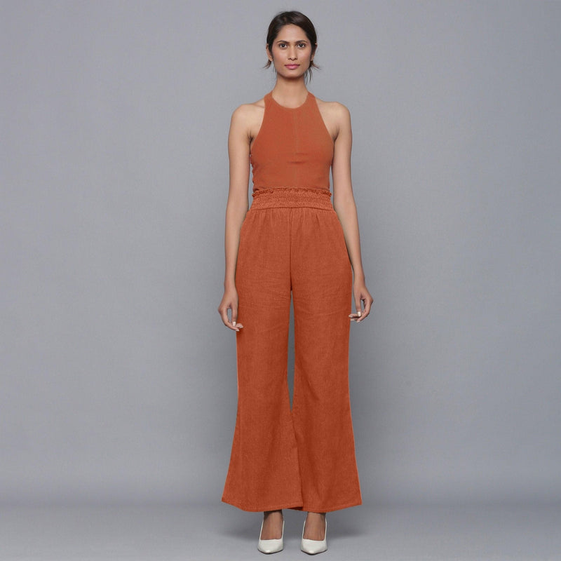 Front View of a Model wearing Sunset Rust Corduroy Striped Bootcut Pant