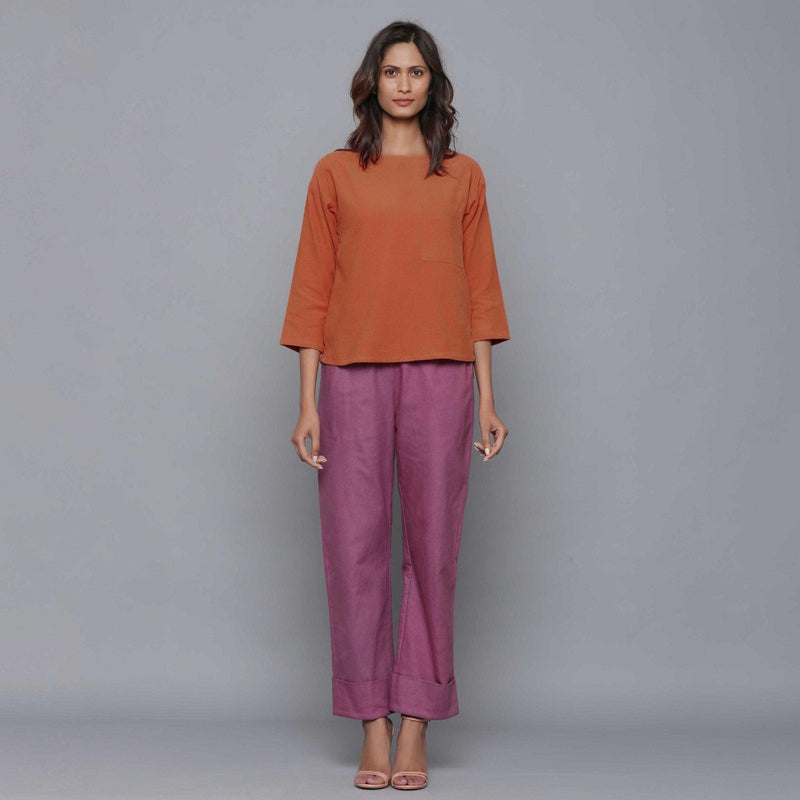 Front View of a Model wearing Sunset Rust Corduroy Drop Shoulder Top