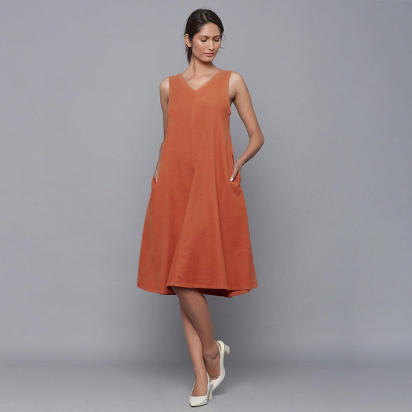 Front View of a Model wearing Sunset Rust Corduroy Flared Dress