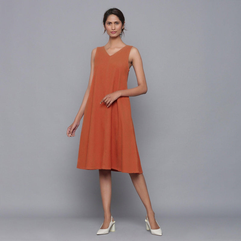 Front View of a Model wearing Sunset Rust Corduroy Flared Dress