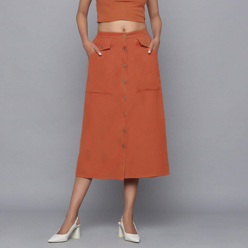 Front View of a Model wearing Sunset Rust Button-Down Midi Skirt