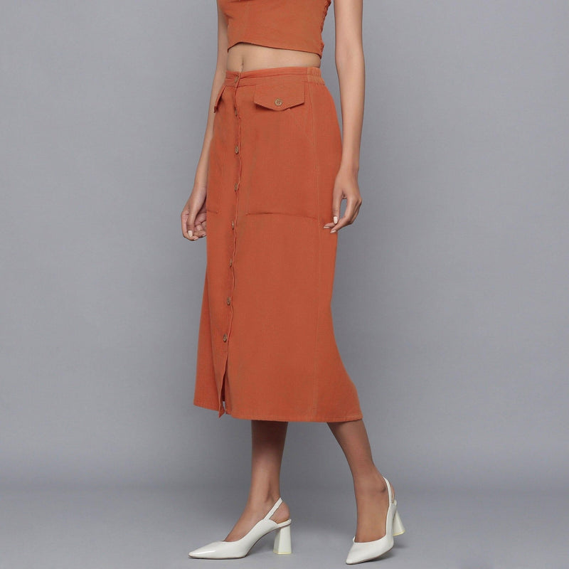 Left View of a Model wearing Sunset Rust Button-Down Midi Skirt