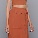 Right Detail of a Model wearing Sunset Rust Button-Down Midi Skirt