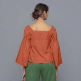 Back View of a Model Sunset Rust Pistachio Corduroy Bohemian Top