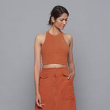 Front View of a Model wearing Sunset Rust Corduroy Halter Neck Top