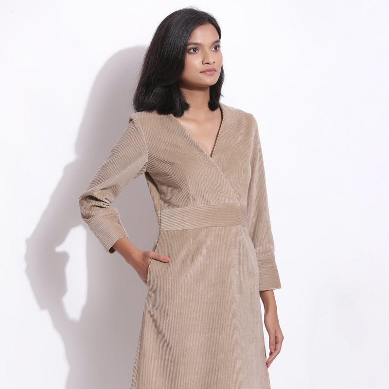 Front Detail of a Model wearing Cotton Corduroy Taupe Beige Surplice Dress