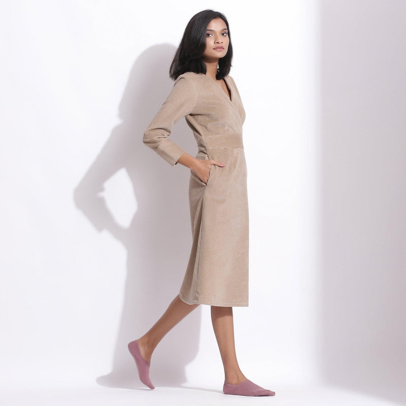 Right View of a Model wearing Cotton Corduroy Taupe Beige Surplice Dress