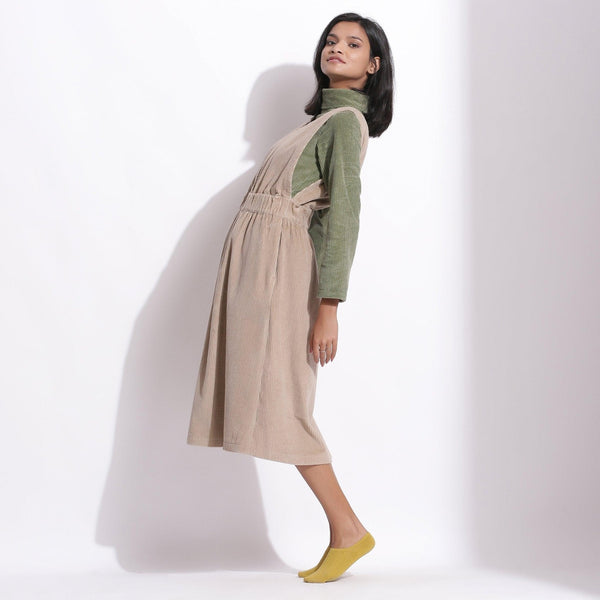 Left View of a Model wearing Taupe Beige Cotton Corduroy Pinafore Dress