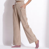 Left View of a Model wearing Beige Corduroy Wide-Legged Trouser Pant