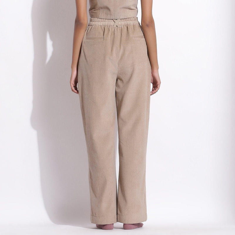 Back View of a Model wearing Taupe Beige Corduroy Wide-Legged Trouser Pant