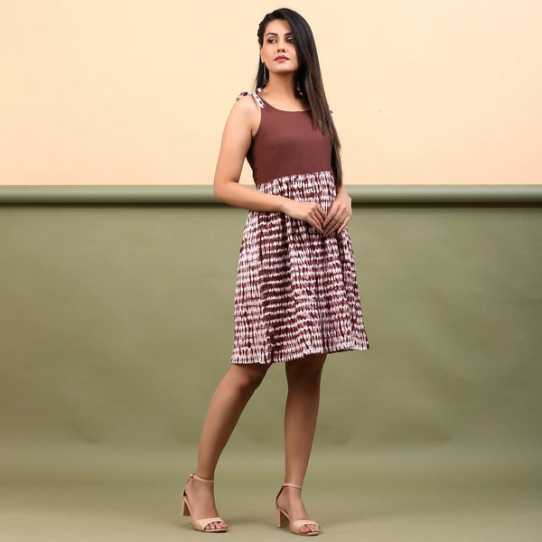 Right View of a Model wearing Taupe Shibori Tie-Dye Cotton Gathered Short Dress