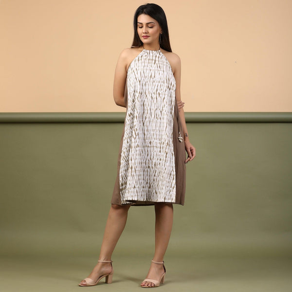 Front View of a Model wearing Taupe Tie-Dye Cotton Knee Length Halter Neck Dress