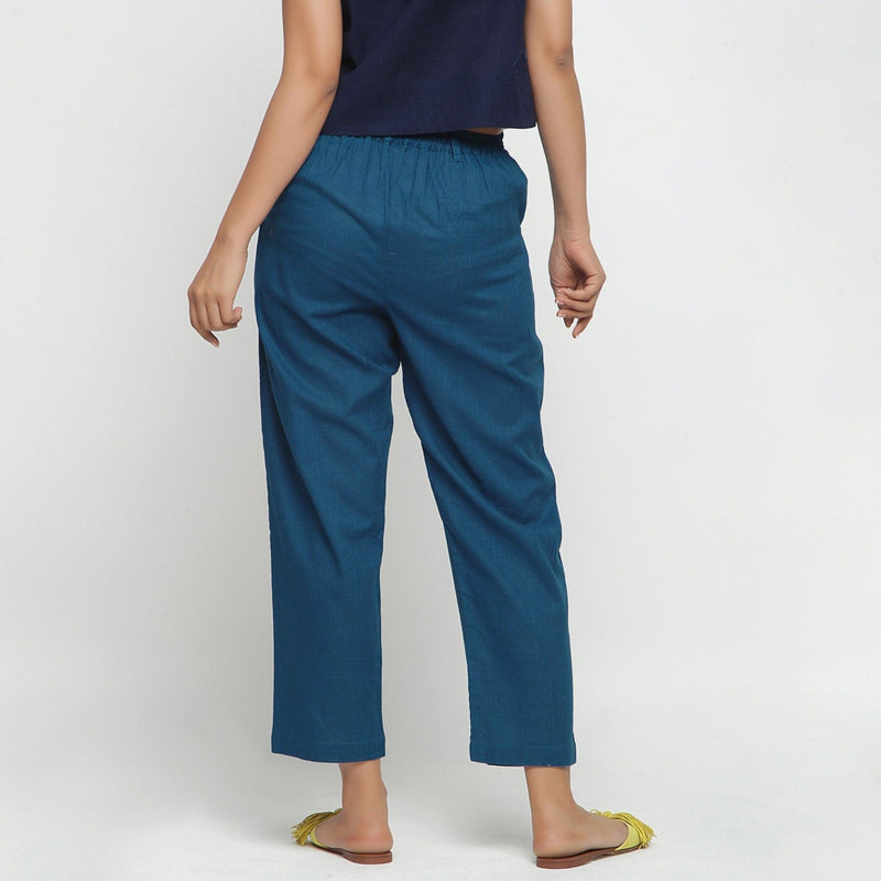 Back View of a Model wearing Teal Ankle Length Mid-Rise Chinos