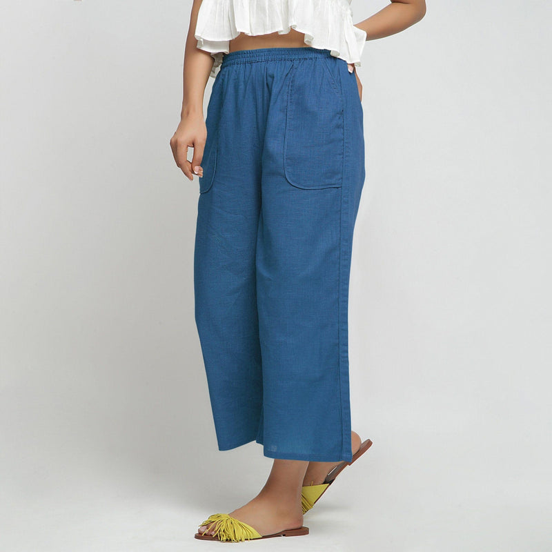 Left View of a Model wearing Teal Wide Legged Straight Pant