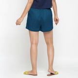 Back View of a Model wearing Teal Solid Cotton Short Shorts