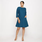 Front View of a Model wearing Teal Blue Yoked Cotton Tunic Dress