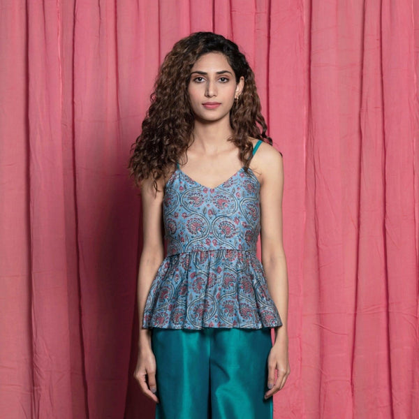 Front View of a Model wearing Teal Block Printed Chanderi Peplum Top