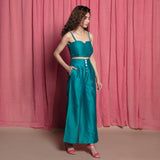 Right View of a Model wearing Teal Cotton Chanderi High-Rise Wide Legged Pant