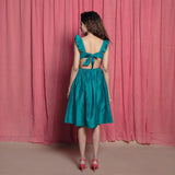 Back View of a Model wearing Teal Cotton Chanderi Knee Length Fit and Flare Dress