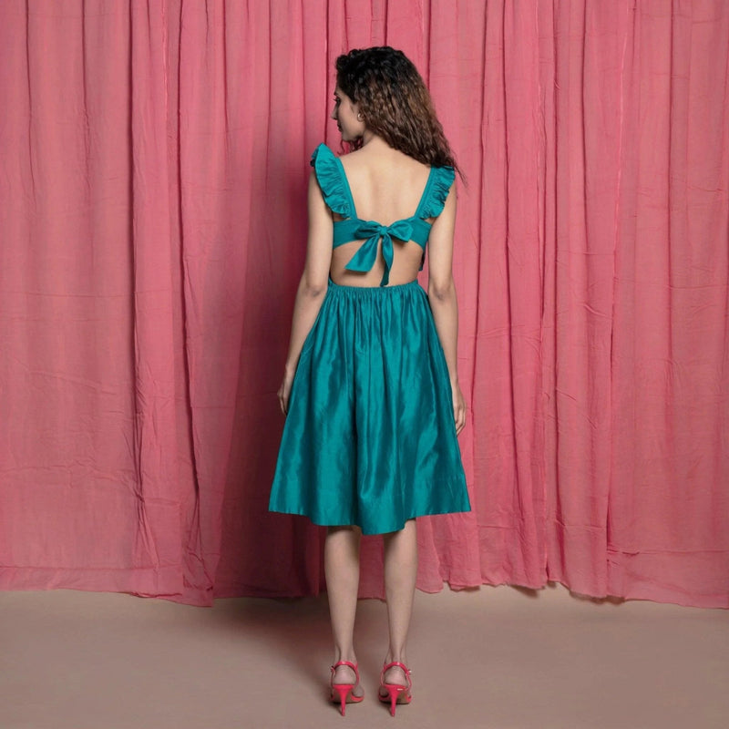 Back View of a Model wearing Teal Cotton Chanderi Knee Length Fit and Flare Dress