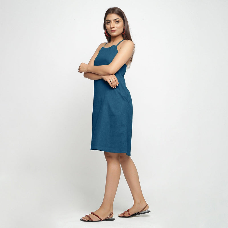 Left View of a Model wearing Teal Criss-Cross Cotton A-Line Dress