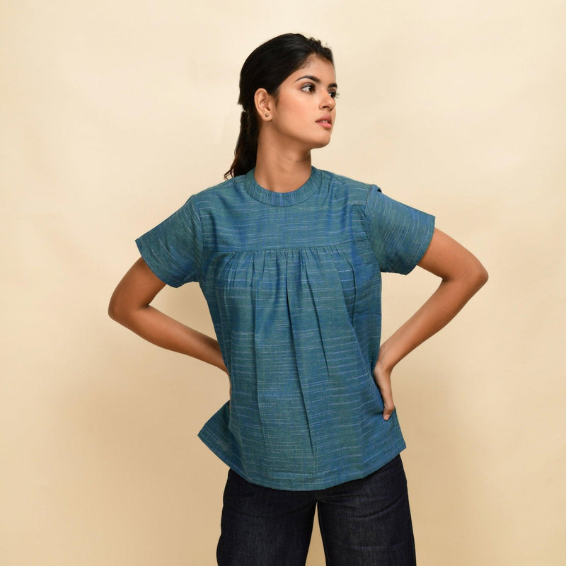 Front View of a Model wearing Teal Handspun Cotton Relaxed Fit Gathered Top