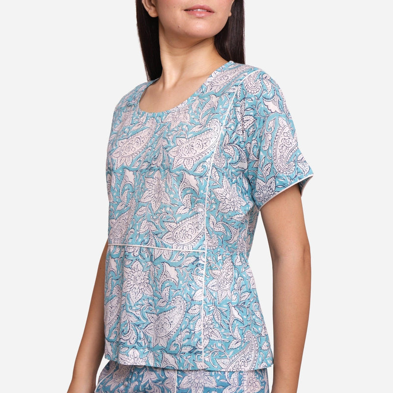 Left Detail of a Model wearing Turquoise Sanganeri Paisley Print Top