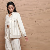 Left View of a Model wearing Undyed Ecru Warm Cotton Muslin Short Jacket