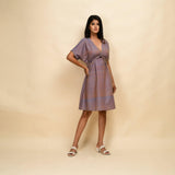 Right View of a Model wearing Vintage Plum 100% Cotton Knee Length Blouson Dress