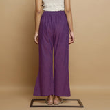 Back View of a Model wearing Violet Yarn Dyed Cotton Elasticated Mid-Rise Godet Pant