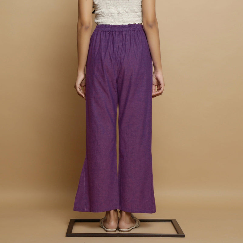 Back View of a Model wearing Violet Yarn Dyed Cotton Elasticated Mid-Rise Godet Pant