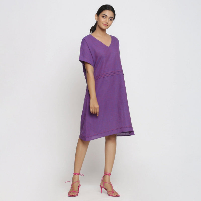 Right View of a Model wearing Violet Cotton V-Neck Pleated Dress